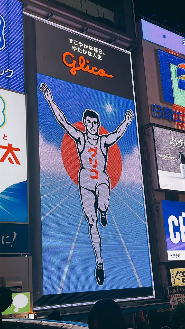 Who is the Glico Running Man Everyone's Taking Photos of in Osaka?